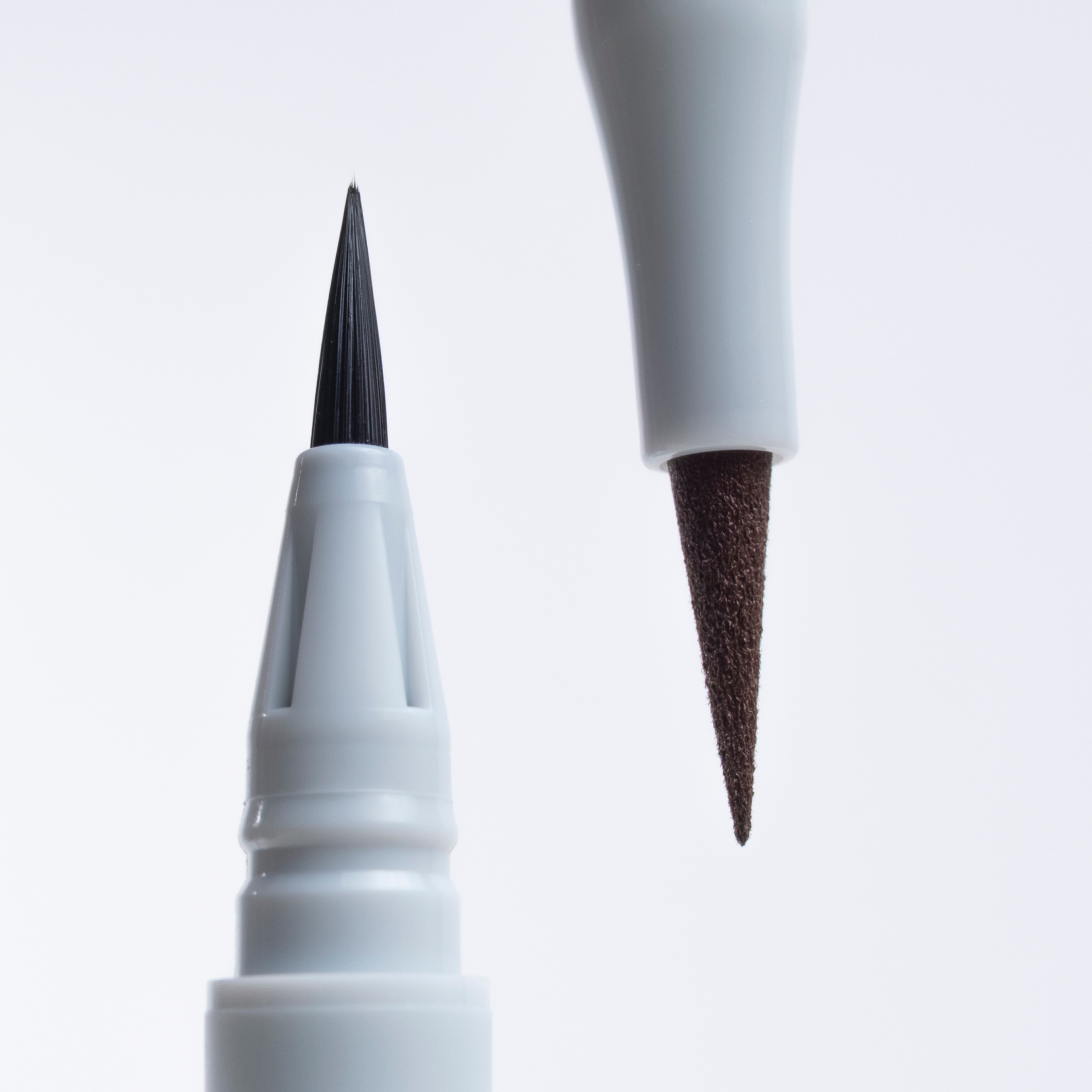 Eyeliner set featuring a matte brown shade and a waterproof black shade by SOPHIA MAE.