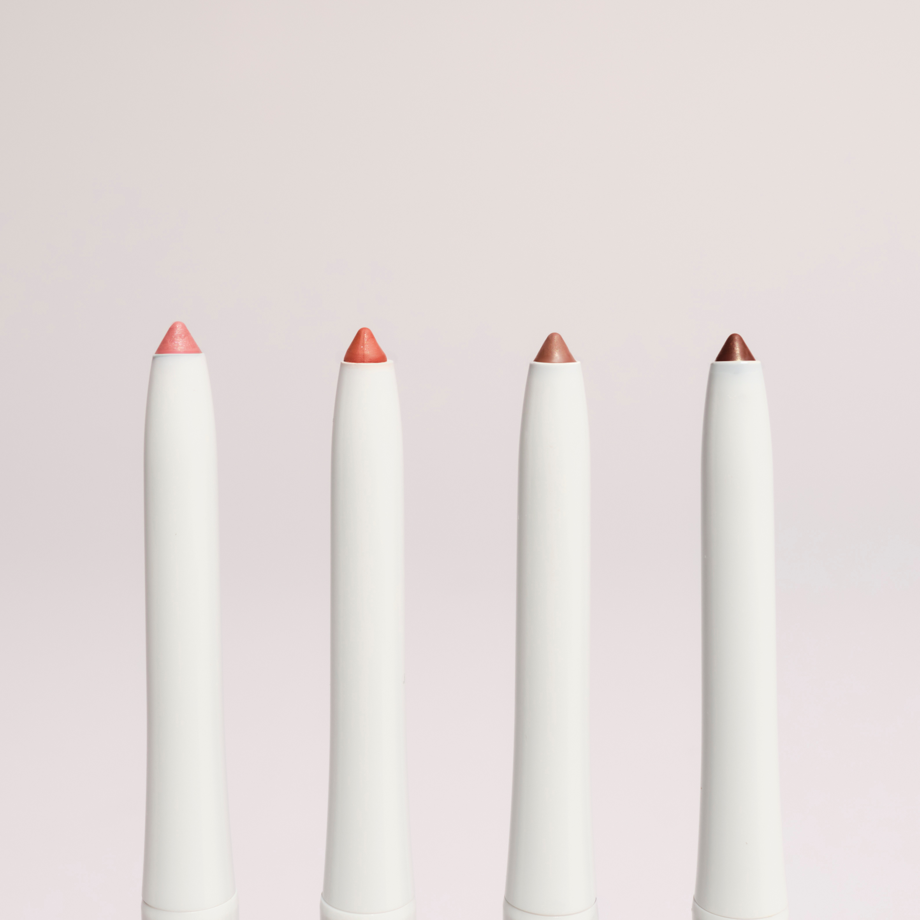 SOPHIA MAE lip liner set with four shades from cool to warm and a built-in sharpener.
