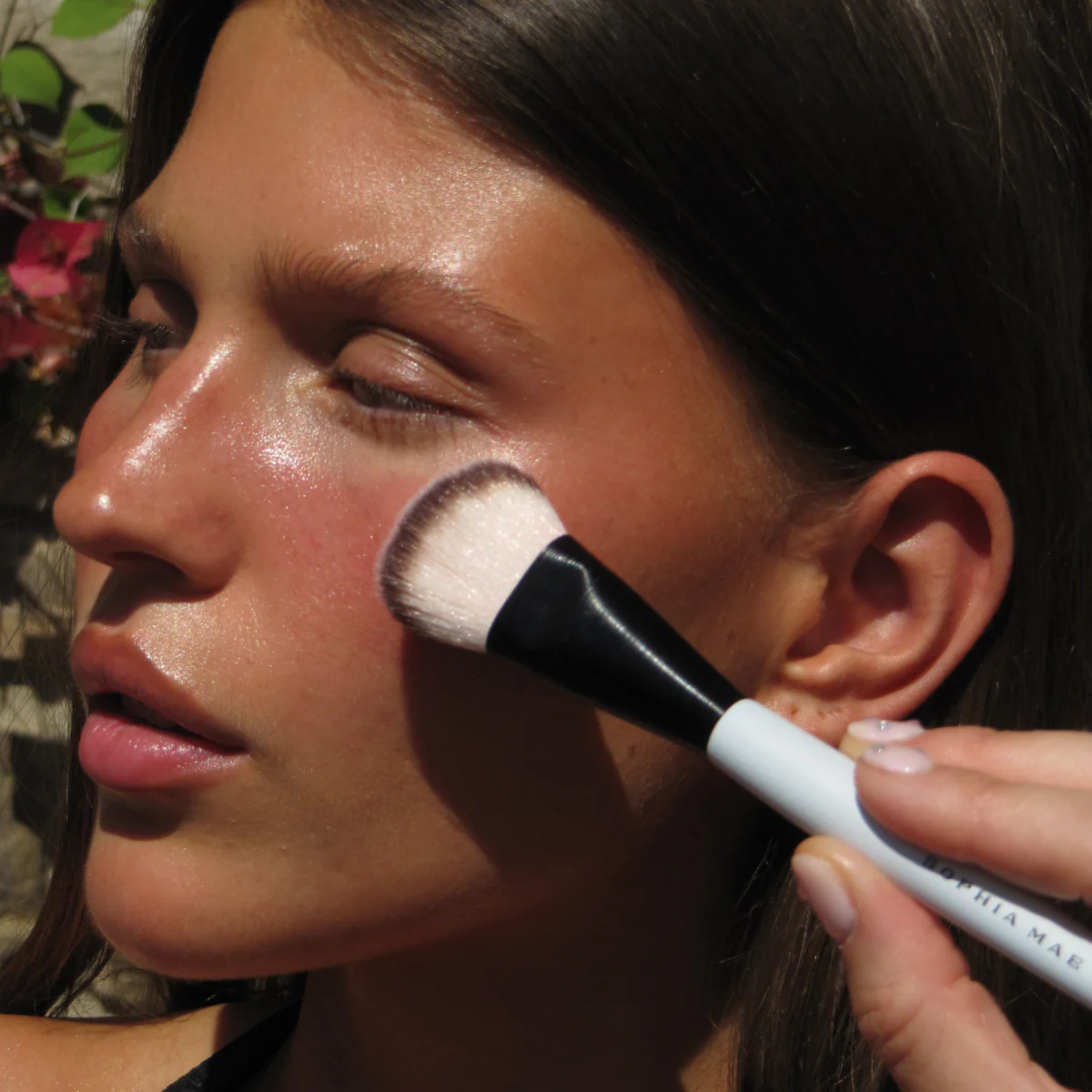 SOPHIA MAE Tan Blusher applied to the cheek with a makeup brush for a sun-kissed glow.