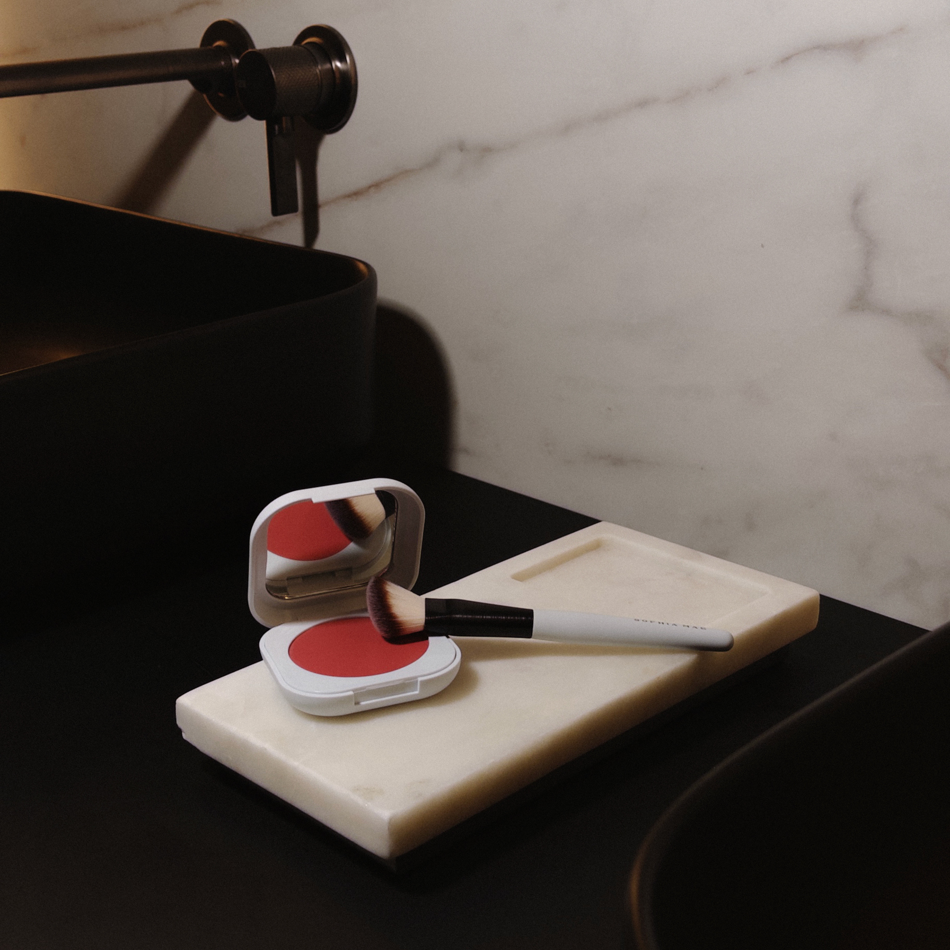 SOPHIA MAE Blush & Brush Bundle featuring the Cream Blush and Liquid Blending Brush in a refined bathroom setting.