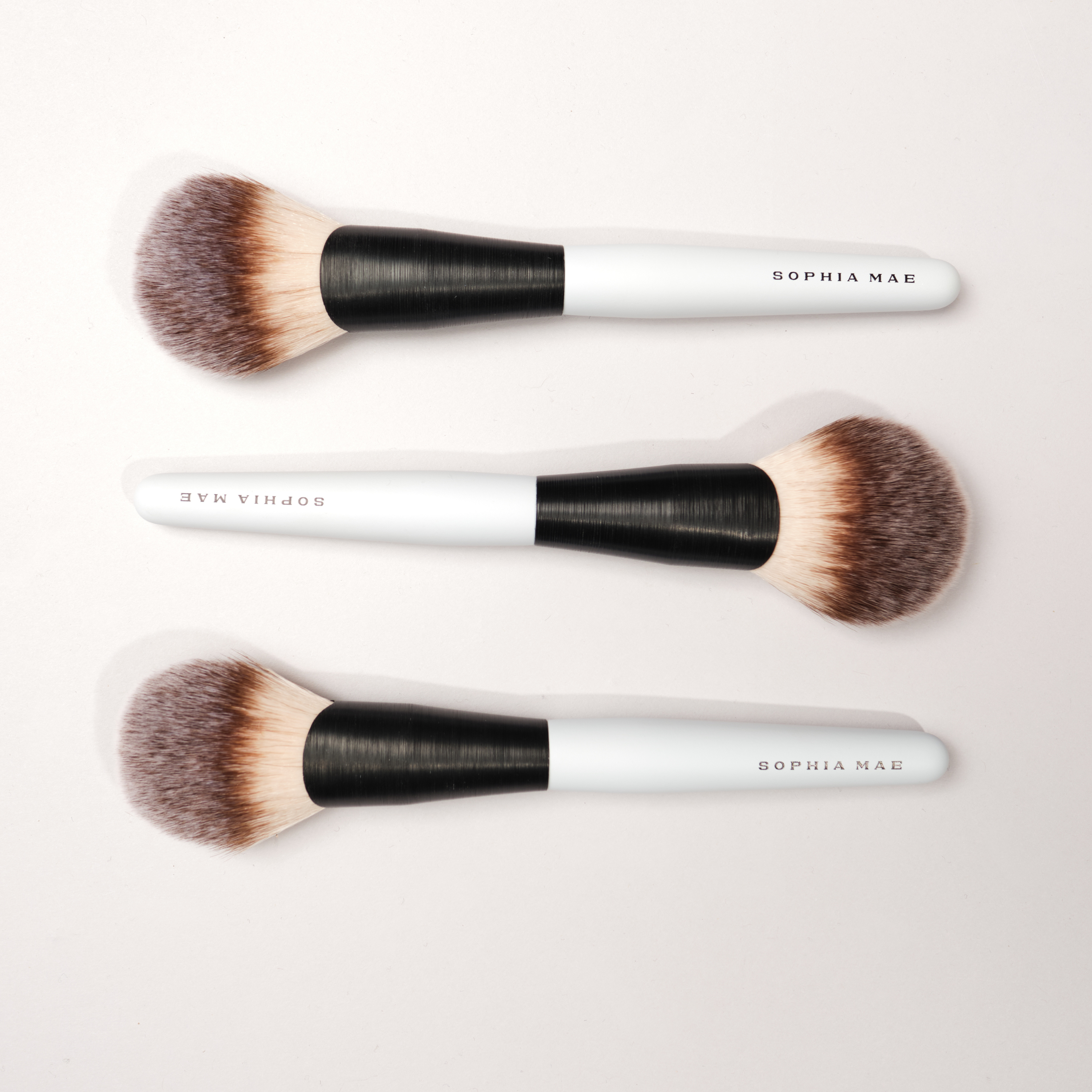 Bronzer brush for smooth finish.