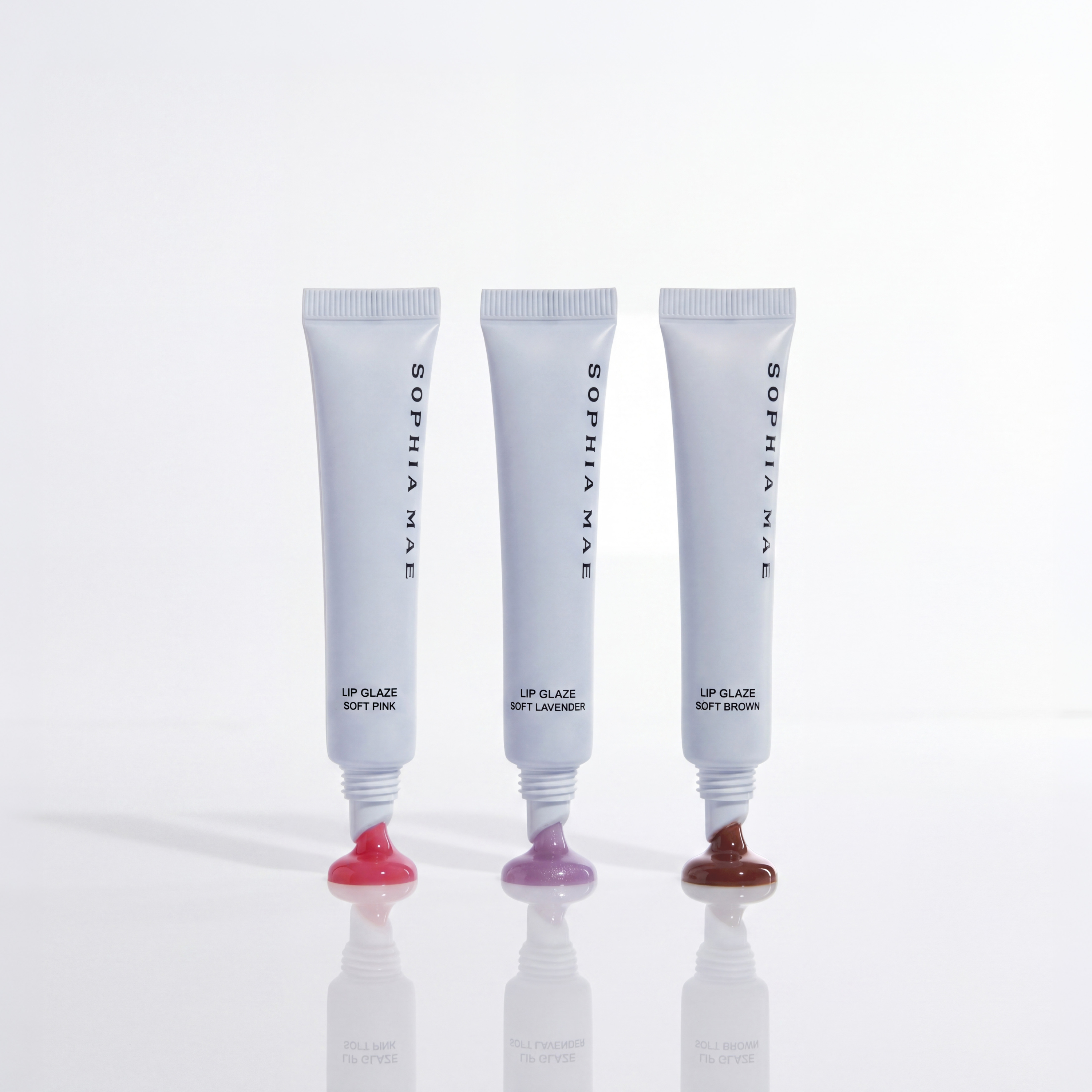 SOPHIA MAE Lip Glaze in three glossy shades.