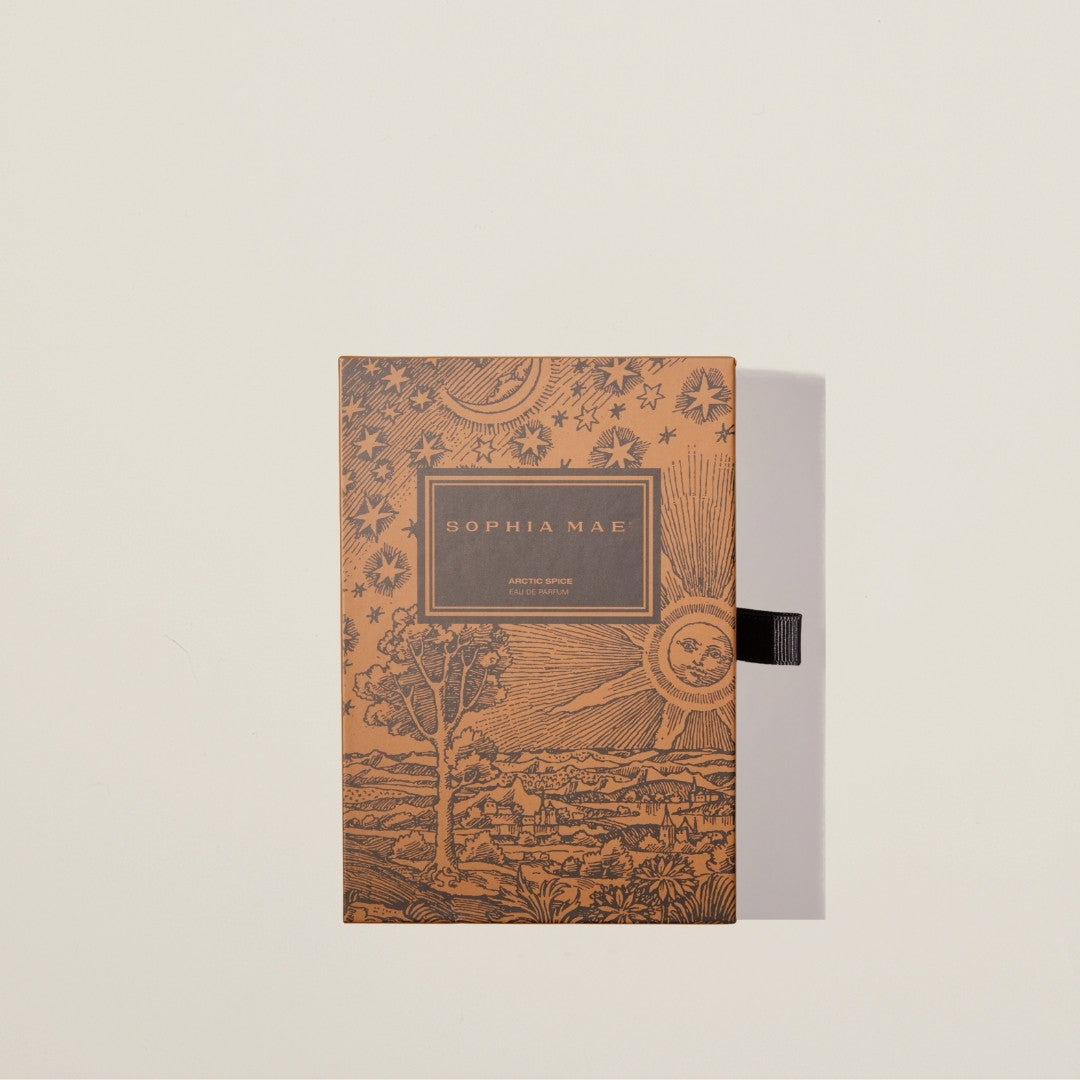 Arctic Spice perfume in elegant bottle – a rich, inviting scent that captures the essence of winter with amber, spices, and creamy musk.