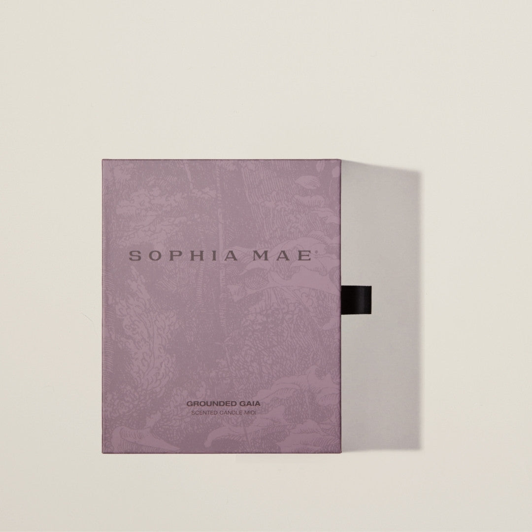 Relaxing luxury scented candle with fig, coconut, and amber – Grounded Gaia enhances your space with tranquility and supports mental health with every purchase.