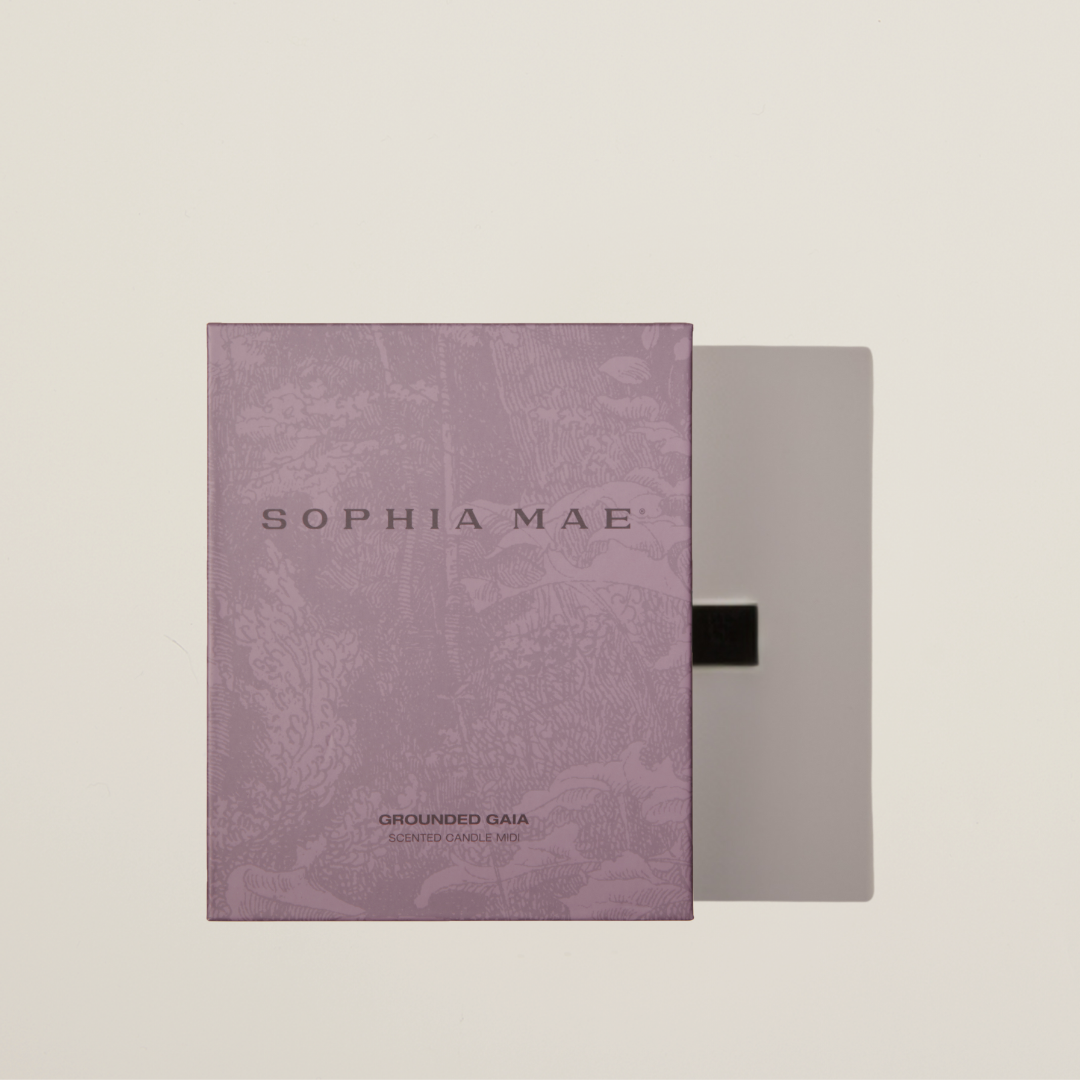 Relaxing luxury scented candle with fig, coconut, and amber – Grounded Gaia enhances your space with tranquility and supports mental health with every purchase.