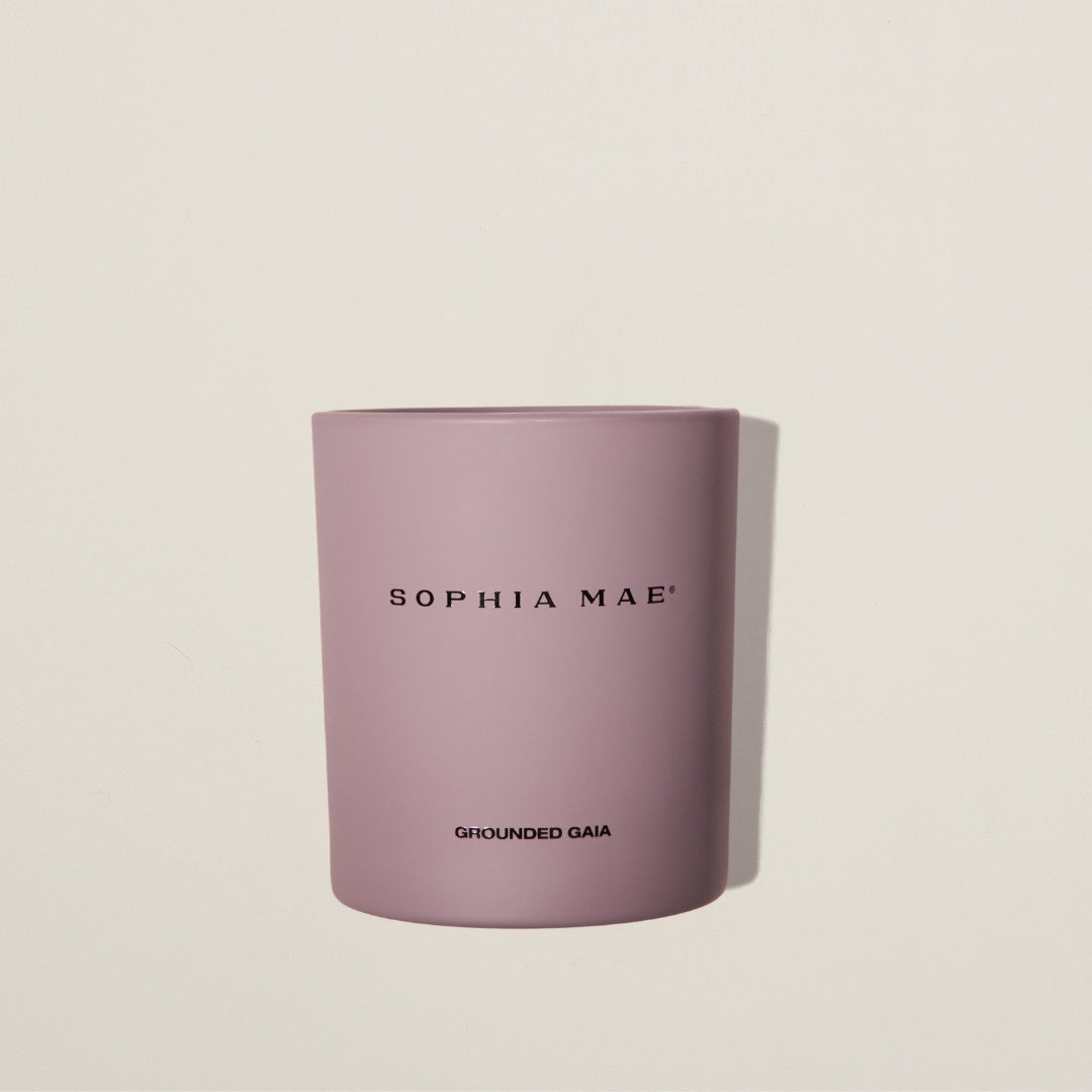Grounded Gaia scented candle in soft purple design – soothing fig and warm earthy notes for a peaceful, mindful atmosphere.
