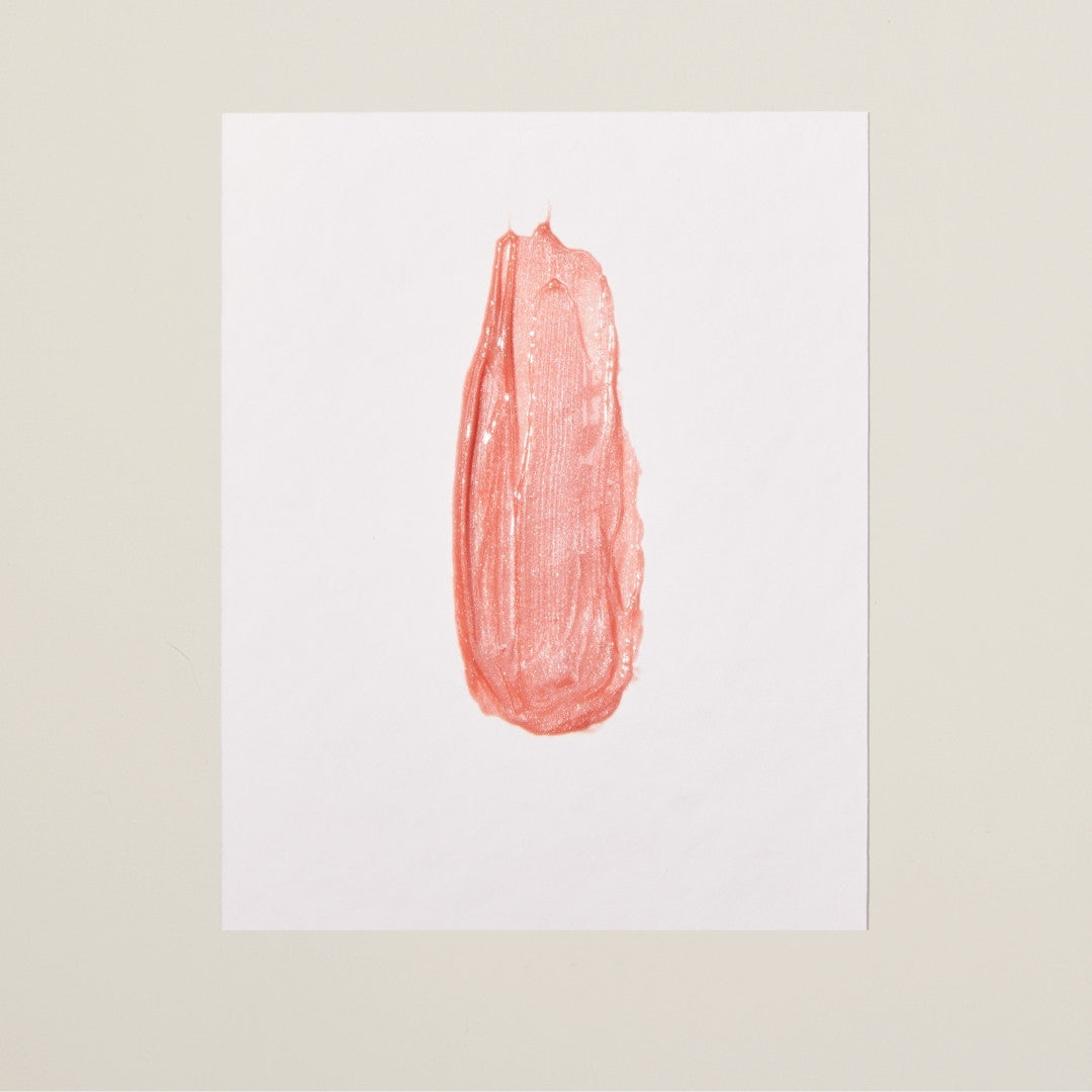 Radiant Rose shade – soft pink volumizing lip gloss with hydrating benefits and a refreshing mint-vanilla sensation.