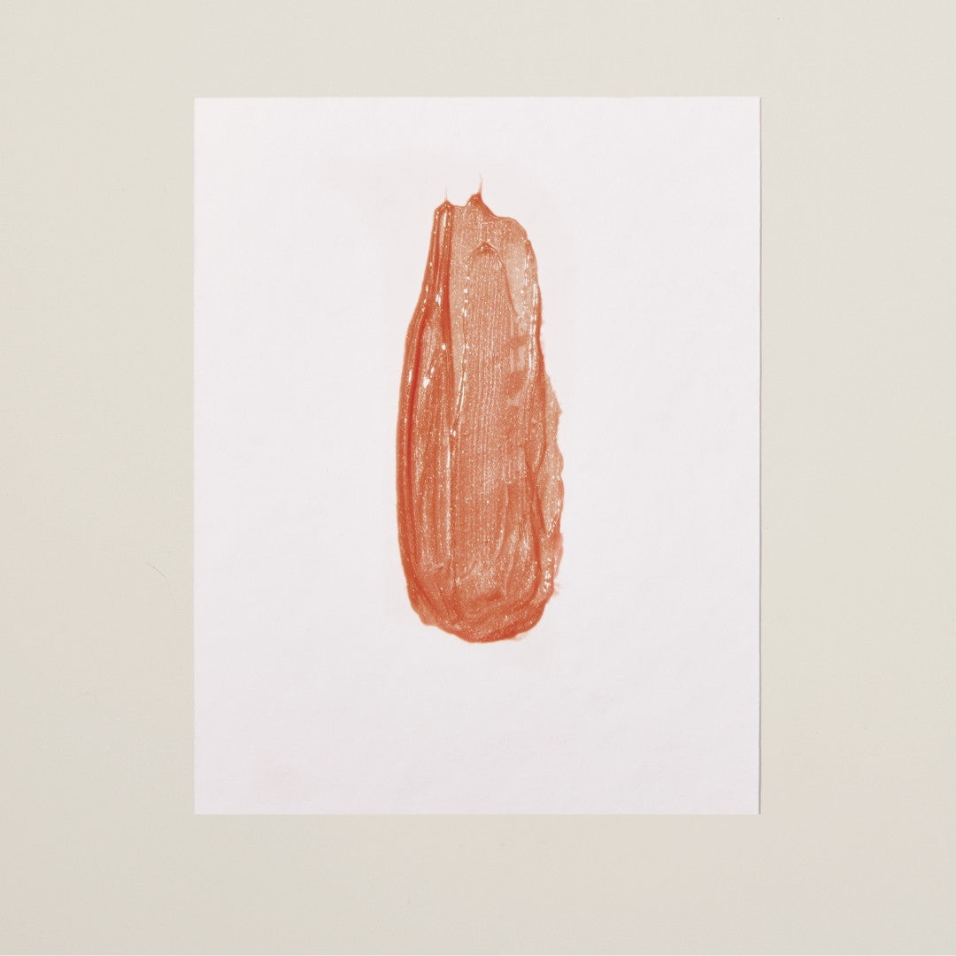 Bare Bliss shade – warm nude plumping lip gloss for a natural, fuller-looking lip with a smooth, glossy finish.