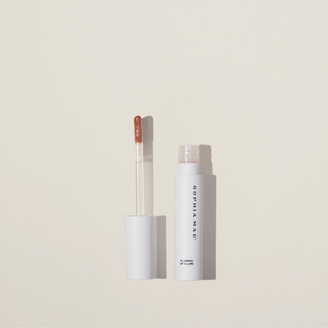 Plumping Lip Allure by SOPHIA MAE – high-shine gloss with botanical oils and vitamin E for healthy, volumized lips.