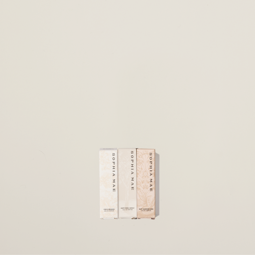 SOPHIA MAE Best Seller eau de parfum mini collection featuring three samples with their matching boxes, photographed on a soft neutral background.