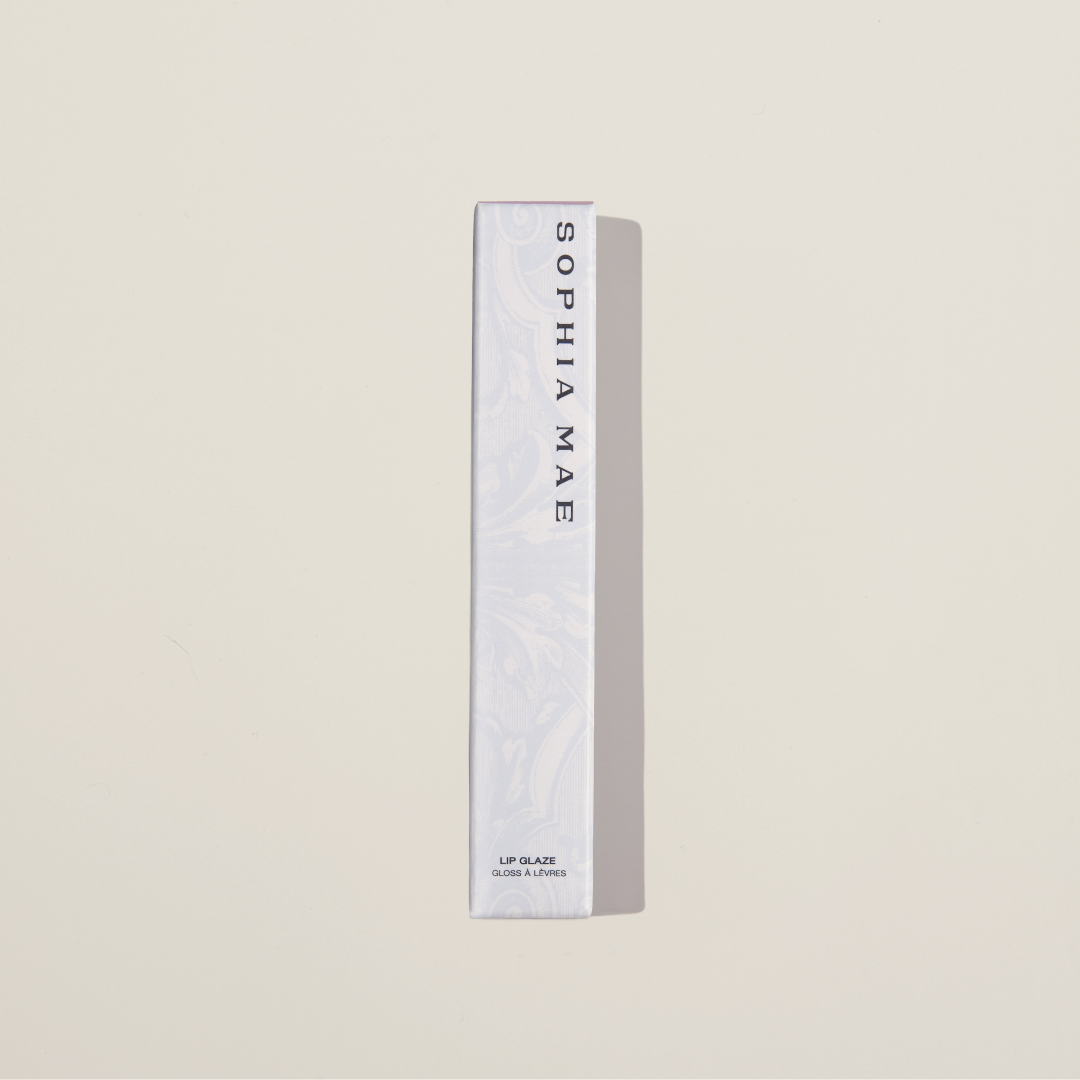 Lip Glaze SOPHIA MAE packaging with beige background.