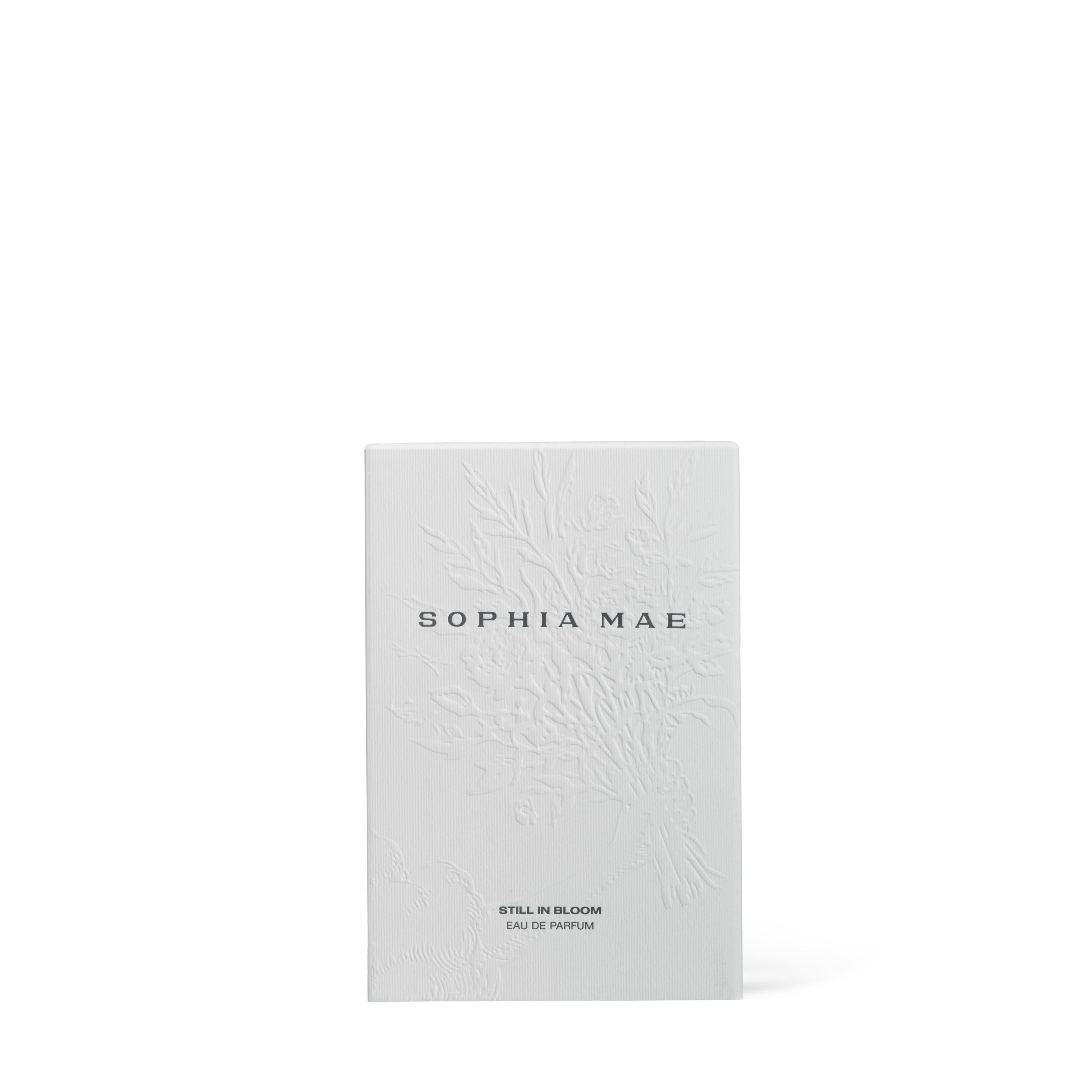 SOPHIA MAE's Still in Bloom eau de parfum in een minimalistische witte verpakking.