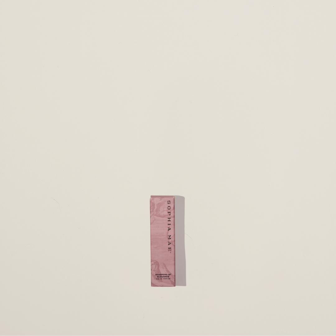 Mini perfume sample of Whispers of Elegance – refined powdery fragrance with warm cedarwood and vanilla.