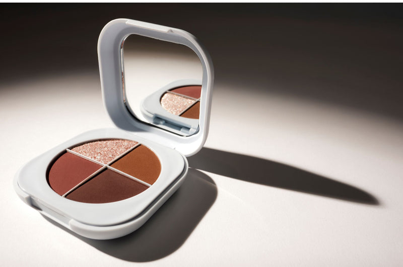 SOPHIA MAE eyeshadow palette featuring four warm-toned shades and a built-in mirror.