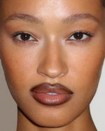 Close-up beauty portrait featuring SOPHIA MAE Lip Liner in Deep Espresso, with rich brown definition around the lips and a softly glossy centre.