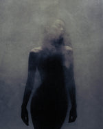 Moody silhouette of a model surrounded by mist, representing SOPHIA MAE Hair Perfume.