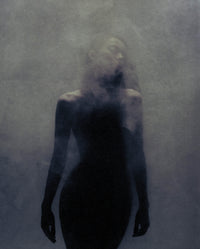 Moody silhouette of a model surrounded by mist, representing SOPHIA MAE Hair Perfume.