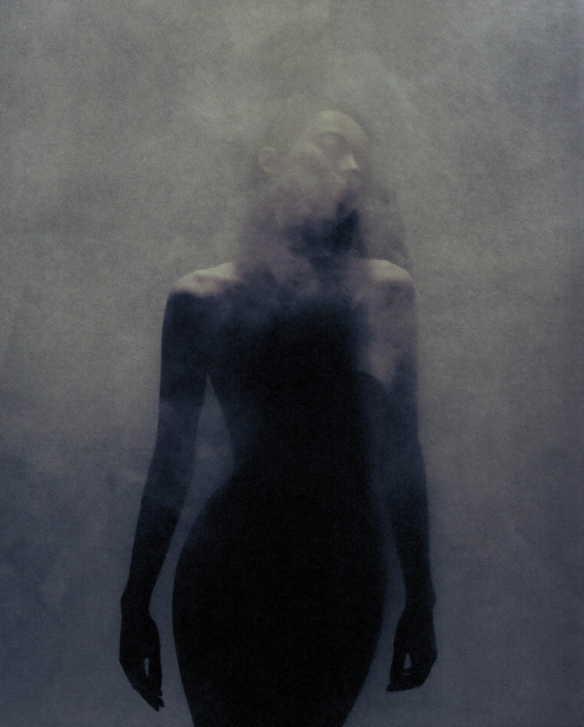 Moody silhouette of a model surrounded by mist, representing SOPHIA MAE Hair Perfume.