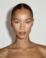 Model wearing SOPHIA MAE Lip Liner in Cool Taupe, creating subtle neutral definition with a soft brown-toned finish.