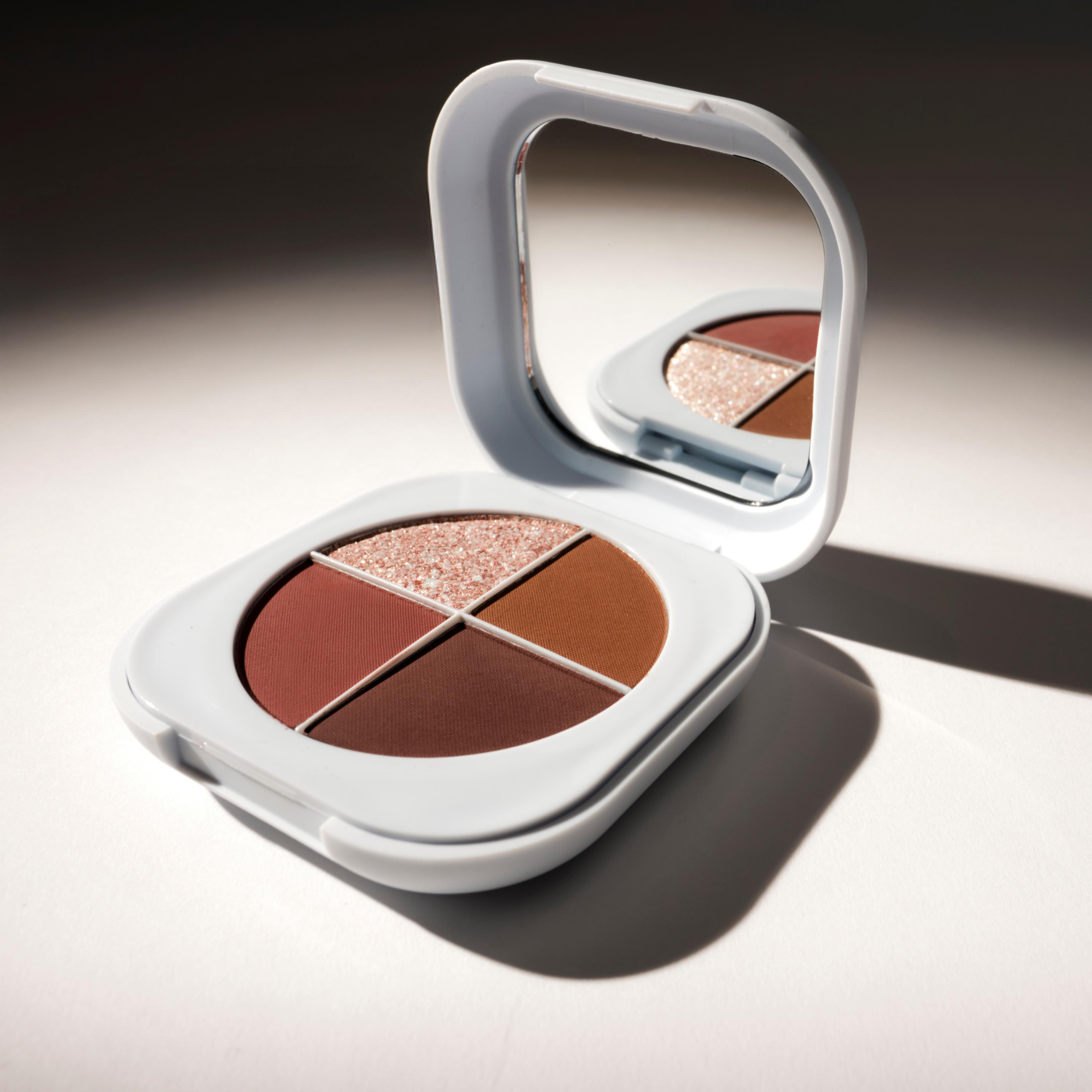 Eyeshadow palette with three matte brown shades and a striking diamond copper shimmer from SOPHIA MAE.