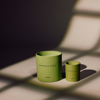 Two SOPHIA MAE Artemis scented candles in Mini and Midi complimented by green glass holders. 