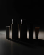 Silhouettes of the five SOPHIA MAE Bestseller selection products, including mini haircare, tanning mist, lip balm and For a Reason perfume.