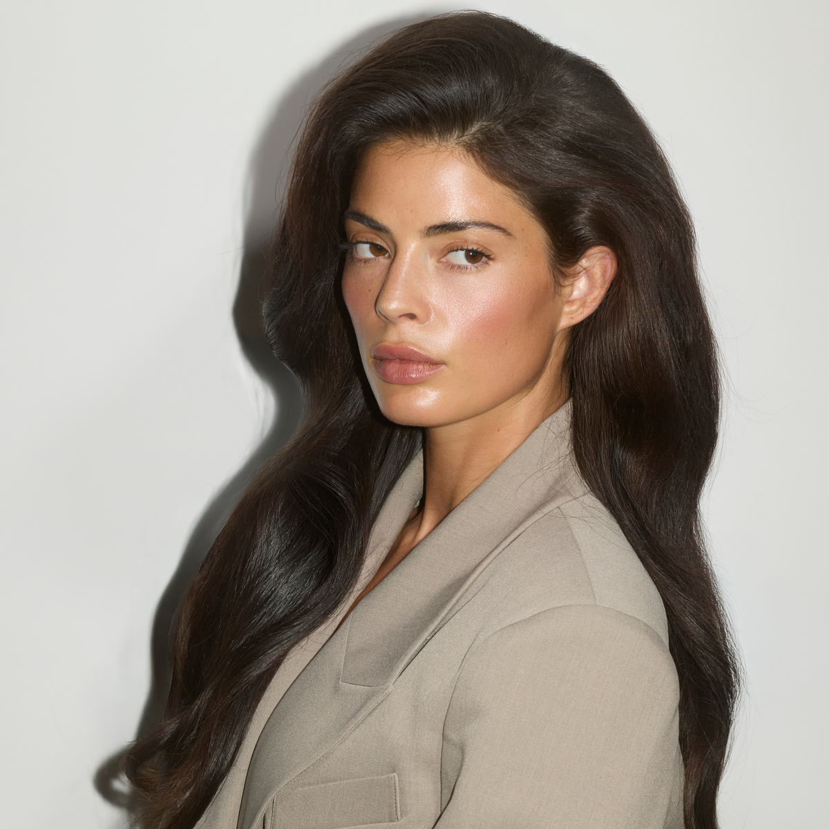 Woman with full, voluminous hair after using SOPHIA MAE Volumizing Dry Shampoo.
