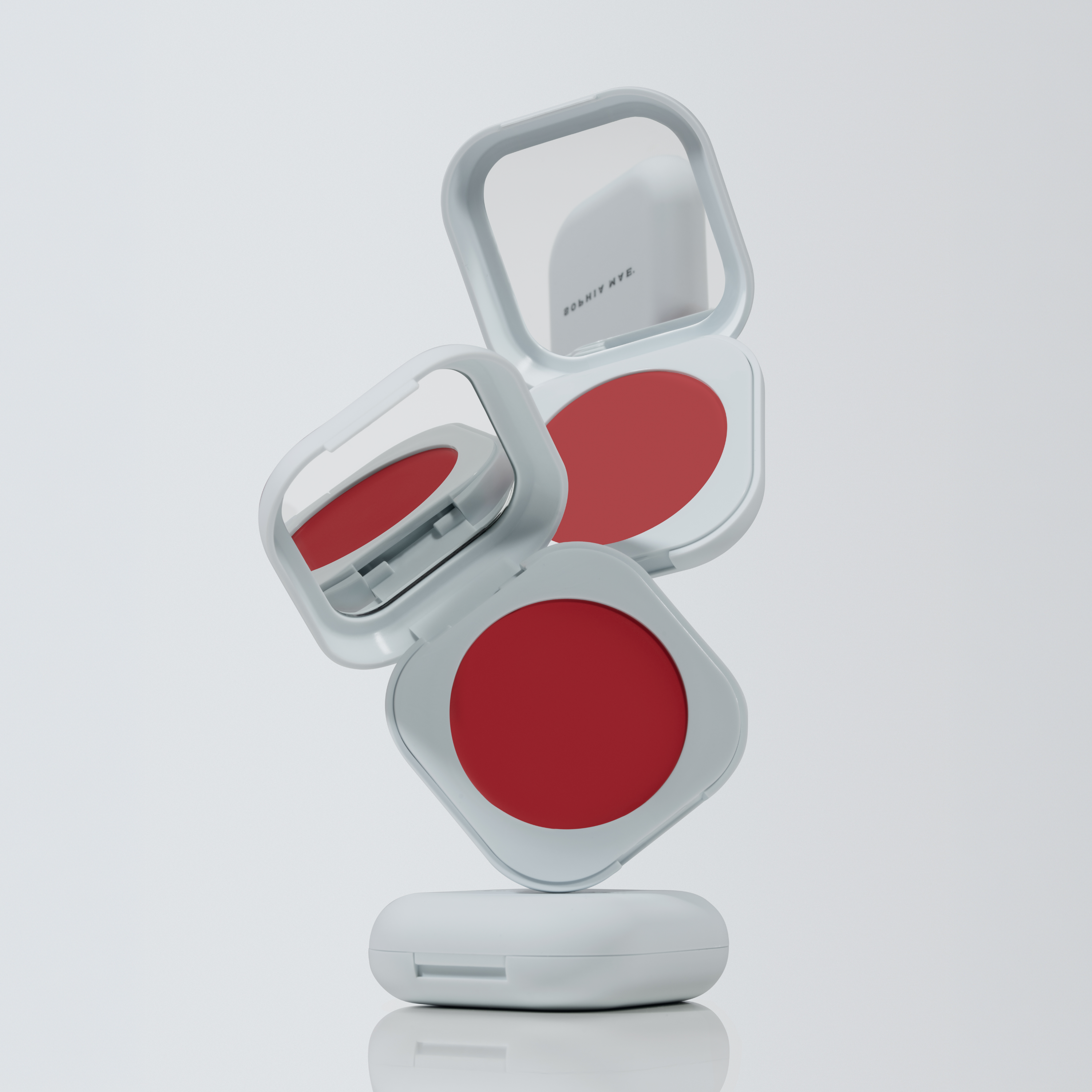 Open SOPHIA MAE Cream Blush compacts displaying multiple shades and built-in mirrors.