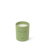 Close-up of the SOPHIA MAE Artemis scented candle in a soft green glass holder 