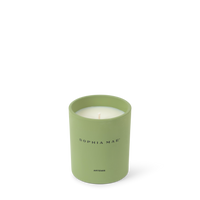 Close-up of the SOPHIA MAE Artemis scented candle in a soft green glass holder 