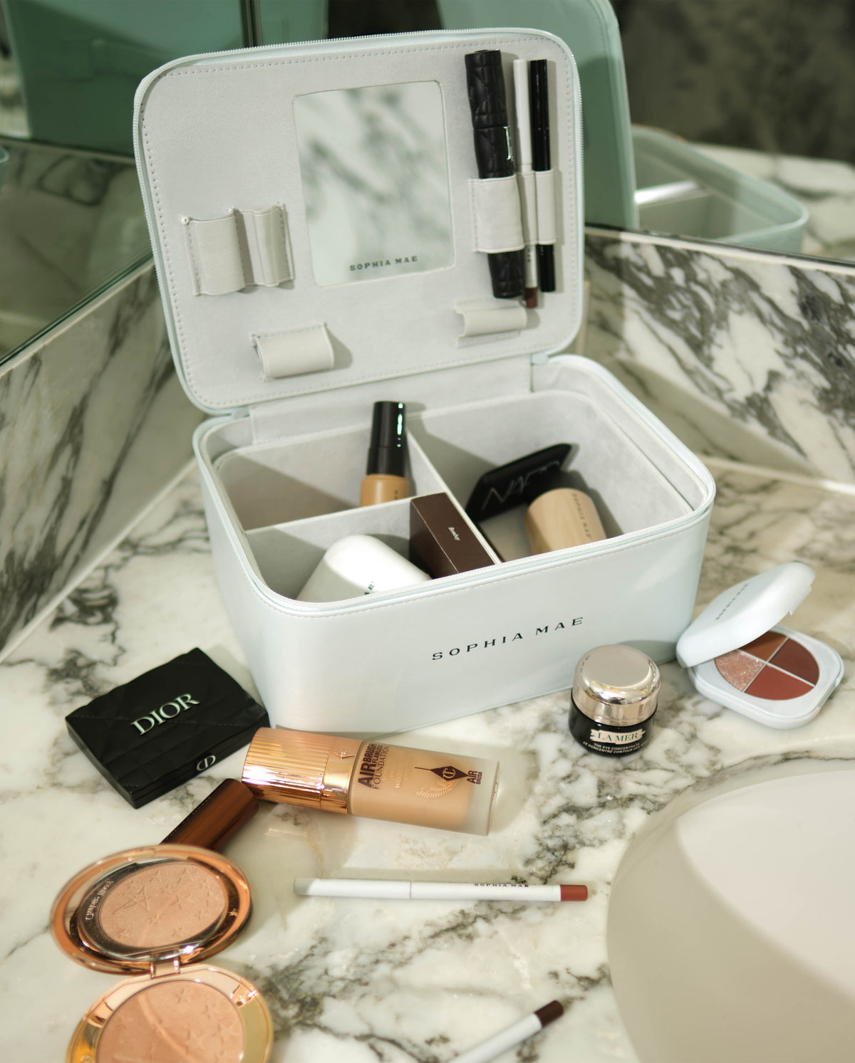SOPHIA MAE Beauty Organizer filled with makeup essentials on a marble counter.