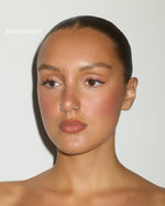 Model wearing SOPHIA MAE Cream Blush in the shade Burgundy.
