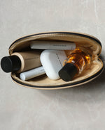 Open SOPHIA MAE Beauty Bag filled with beauty essentials, perfume and makeup products.