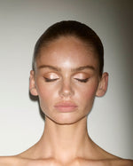 Model wearing SOPHIA MAE Liquid Eyeliner in Coffee Bean with softly shimmering eyeshadow, creating a refined brown eye look.