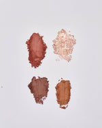Four SOPHIA MAE Eyeshadow Palette swatches in warm matte and shimmering shades, ranging from soft rose and bronze to rich brown tones.