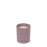 Luxury scented candle for relaxation with the fragrance of fig, amber, coconut and pine