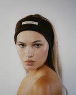 Model wearing a brown SOPHIA MAE headband with sleek hair.
