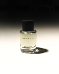 SOPHIA MAE Modern Myth Eau de Parfum bottle in dramatic light.