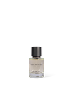 SOPHIA MAE Kept For A While Eau de Parfum bottle with a clear glass design and matte black cap, shown as a clean product cut-out.