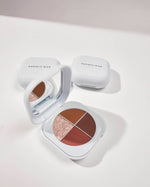 SOPHIA MAE Eyeshadow Palette with four warm-toned shades, including matte browns, a soft rose and a shimmering champagne finish, displayed in an open compact with mirror.