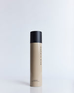 SOPHIA MAE Hairspray in its signature beige bottle with a matte black cap, photographed against a clean studio background.