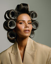Monica Geuze wearing SOPHIA MAE Velcro Hair Rollers, styled to create lift, volume and soft shape through the hair.