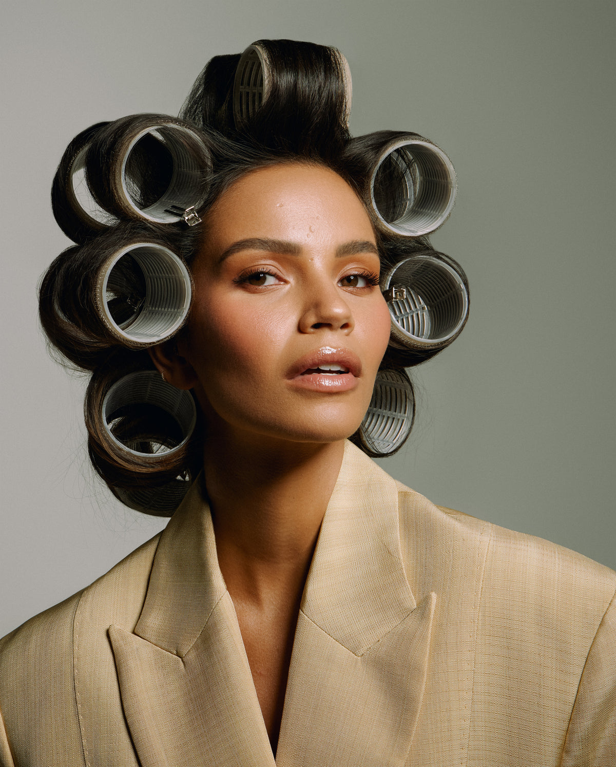 Monica Geuze wearing SOPHIA MAE Velcro Hair Rollers, styled to create lift, volume and soft shape through the hair.