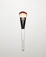 SOPHIA MAE Liquid Blending Brush with soft, dense bristles and a tapered shape, designed for seamless application and blending of liquid complexion products.