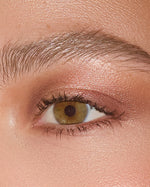 Extreme close-up of an eye wearing SOPHIA MAE Eyeshadow Palette, with a warm rose shimmer blended across the lid for a luminous, softly defined finish.