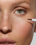 Close-up of a model featuring natural-looking faux freckles across the nose and cheeks created with the SOPHIA MAE Freckle Pen.