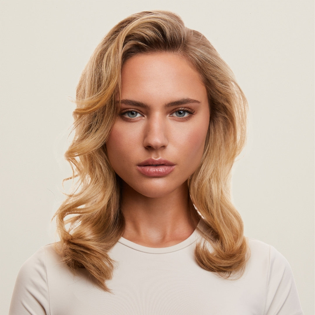Results midi hair rollers for a blowout finish.