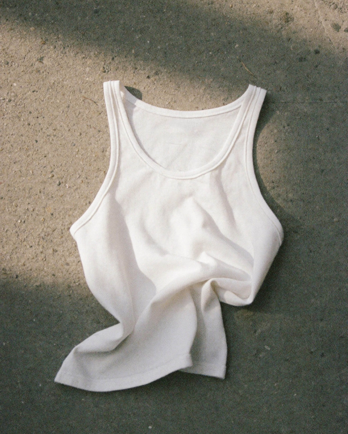 White tank top in sunlight for SOPHIA MAE Modern Myth Eau de Parfum.