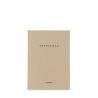 SOPHIA MAE notebook with a minimal beige fabric cover and refined black lettering.