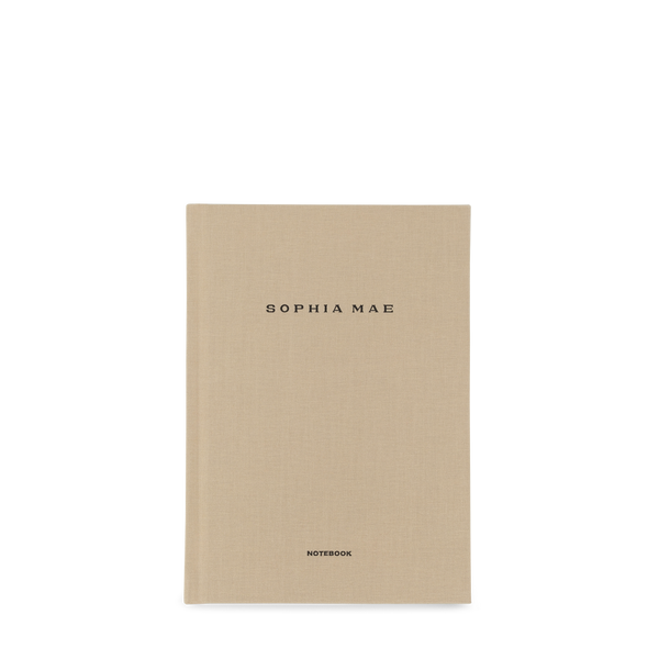SOPHIA MAE notebook with a minimal beige fabric cover and refined black lettering.